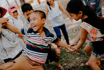 children playing on grass field