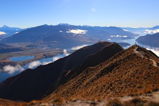 brown mountains under blue sky