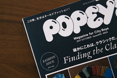 A magazine titled 'Popeye' is prominently displayed with its tagline 'Magazine for City Boys.' It is the October 2017 issue, number 846, priced at 800 yen. The issue is themed around fashion, indicated by a circular emblem stating 'Fashion Issue 2017 AW.' The cover features a collage of colorful fabric swatches against a wooden background.