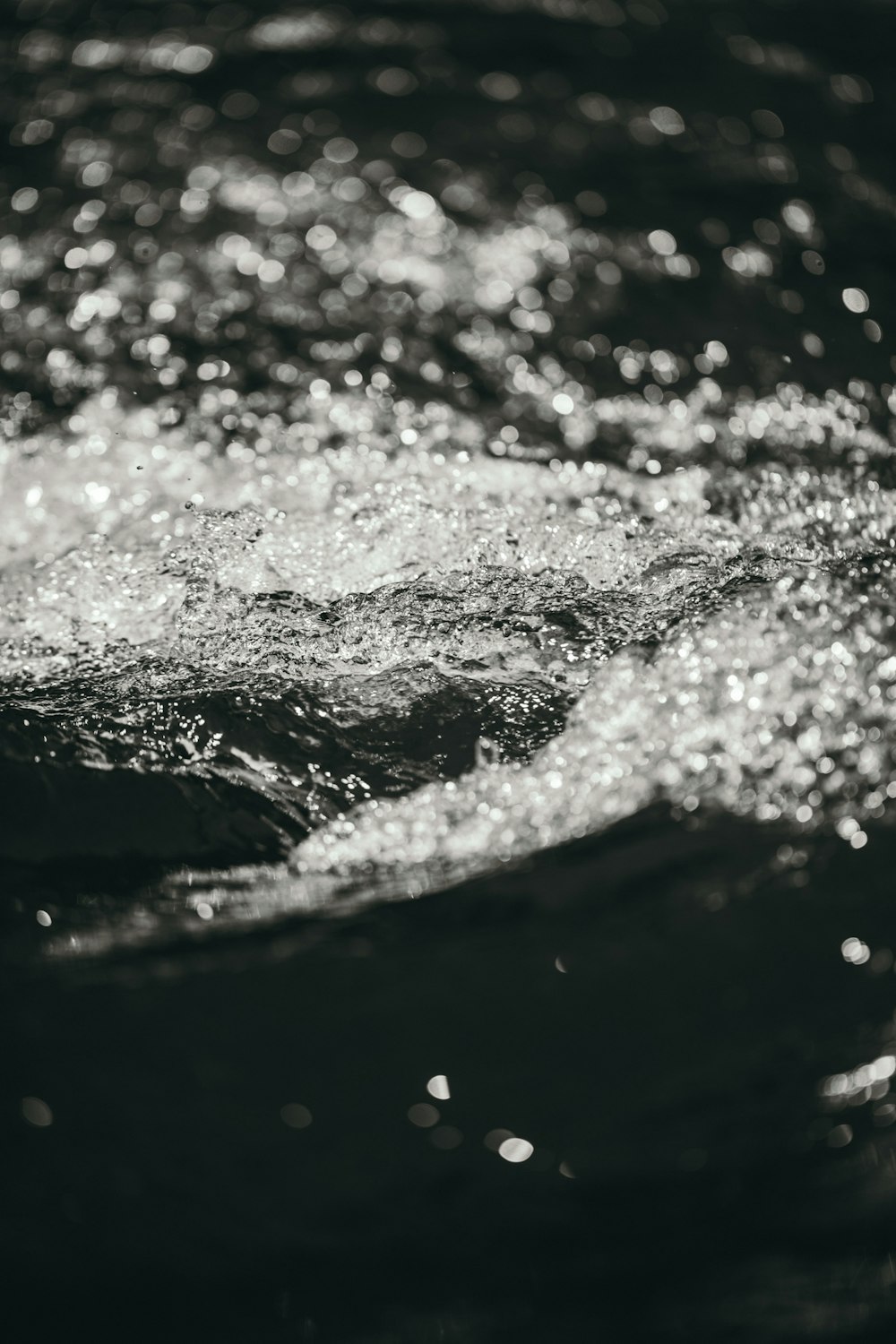 selective focus photography of swirling water