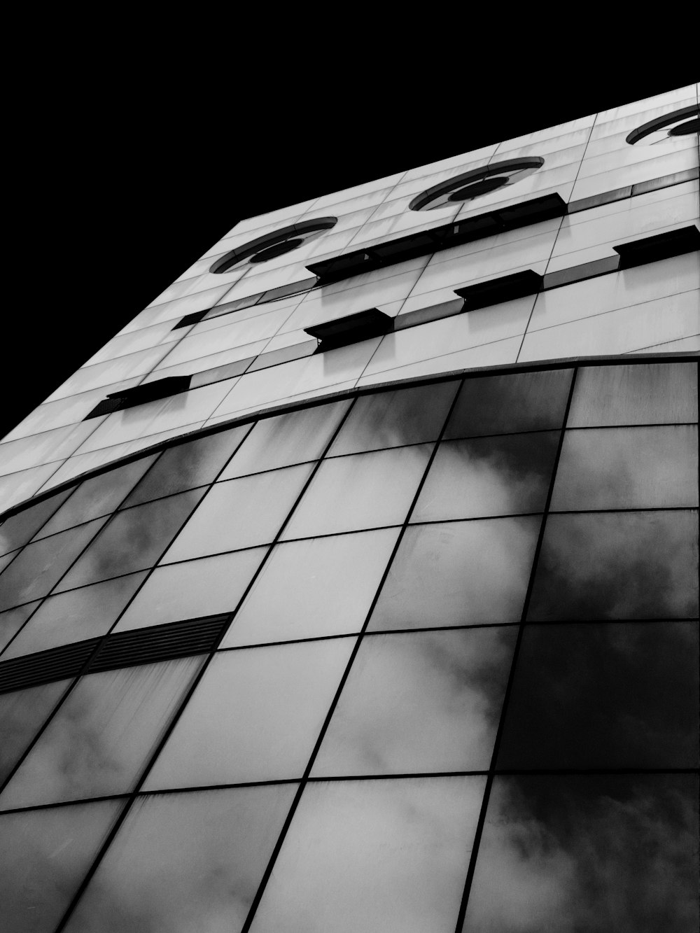 grayscale photo of multi-storey building