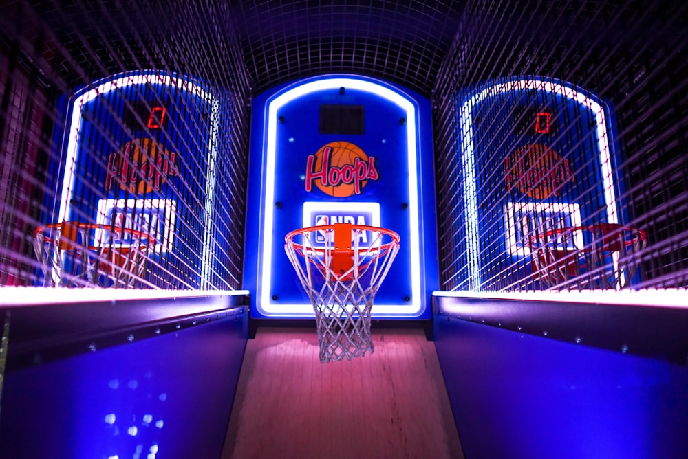 three arcade basketball hoops with lights