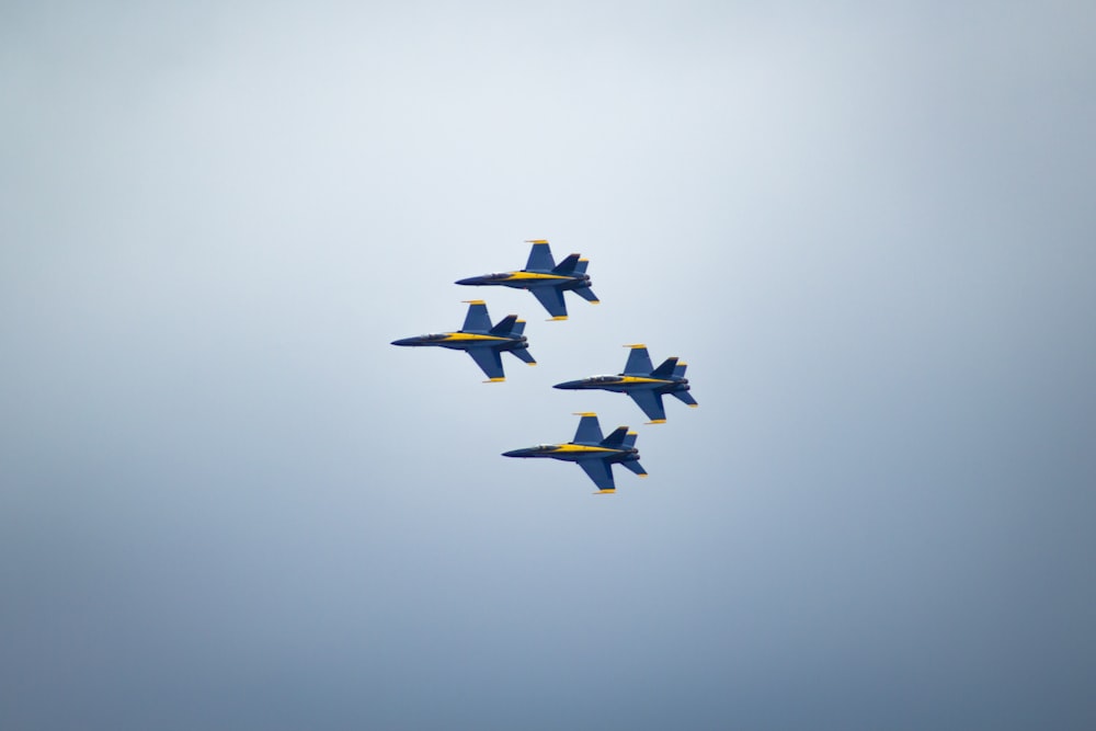 four in flight black aircrafts