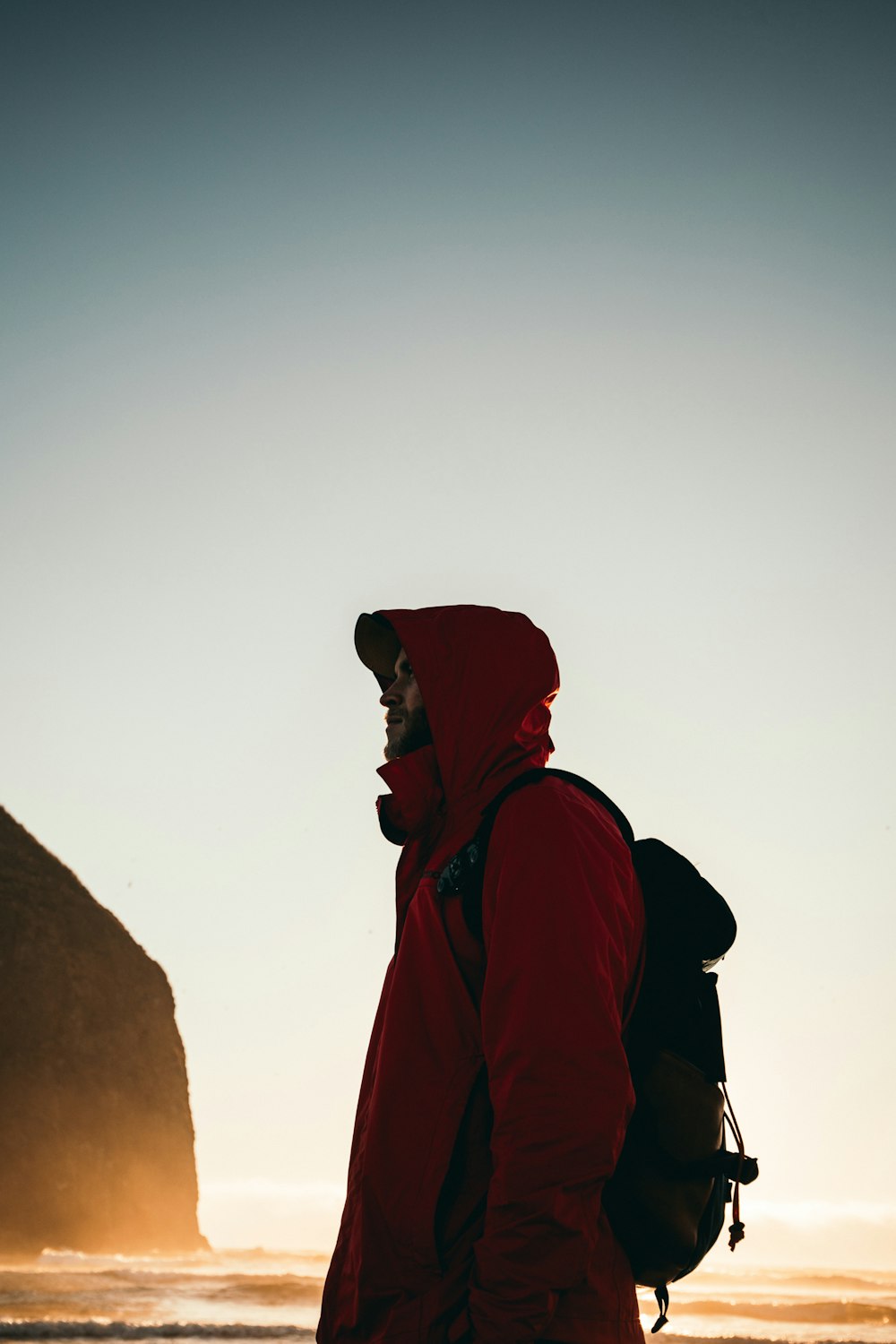 low angle photography of man facing left under golden hour