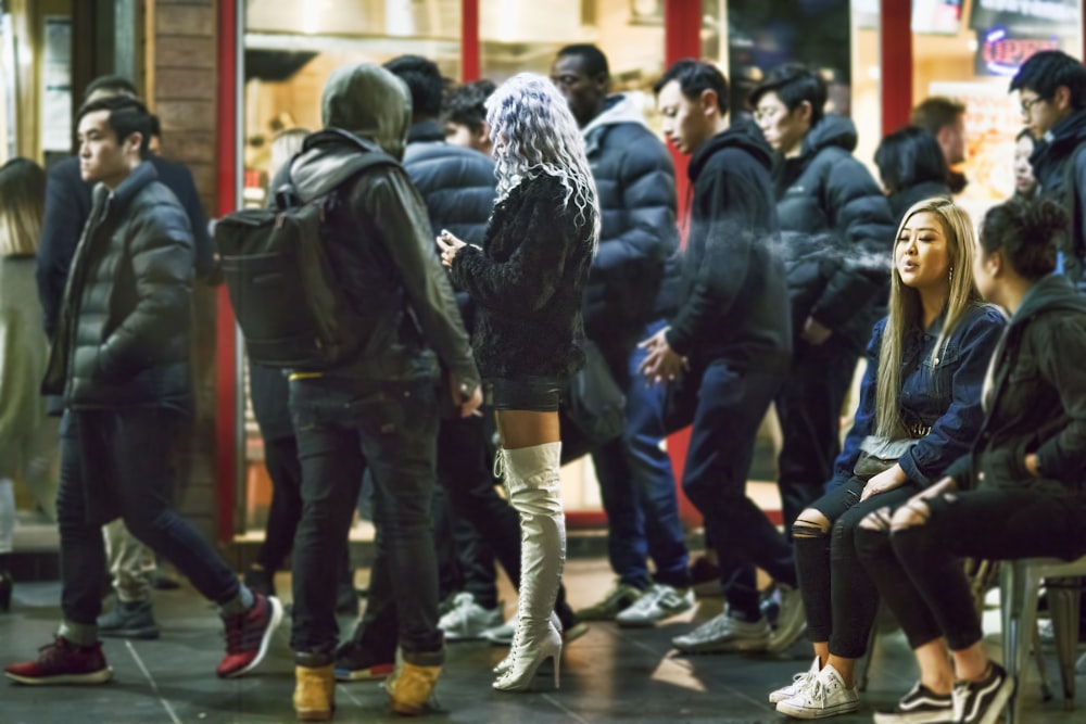 people standing near store