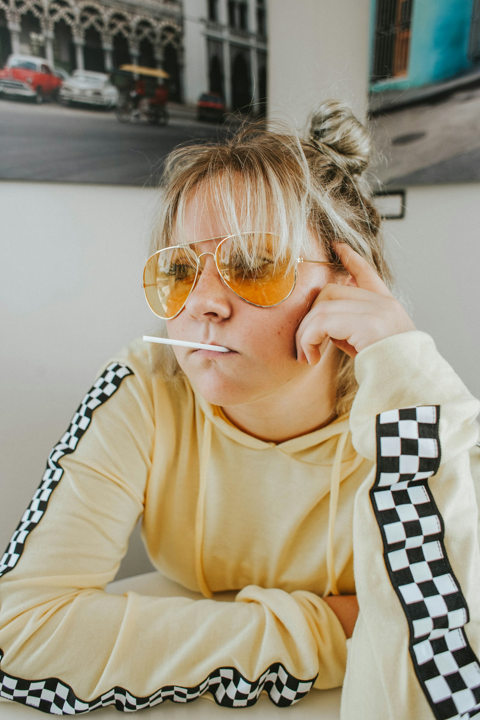 Canon EF 28mm F1.8 USM sample photo. Woman with sunglasses sitting photography