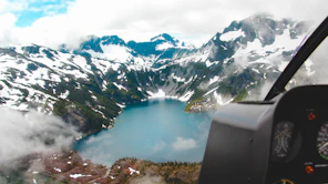 body of water surrounded by mountains