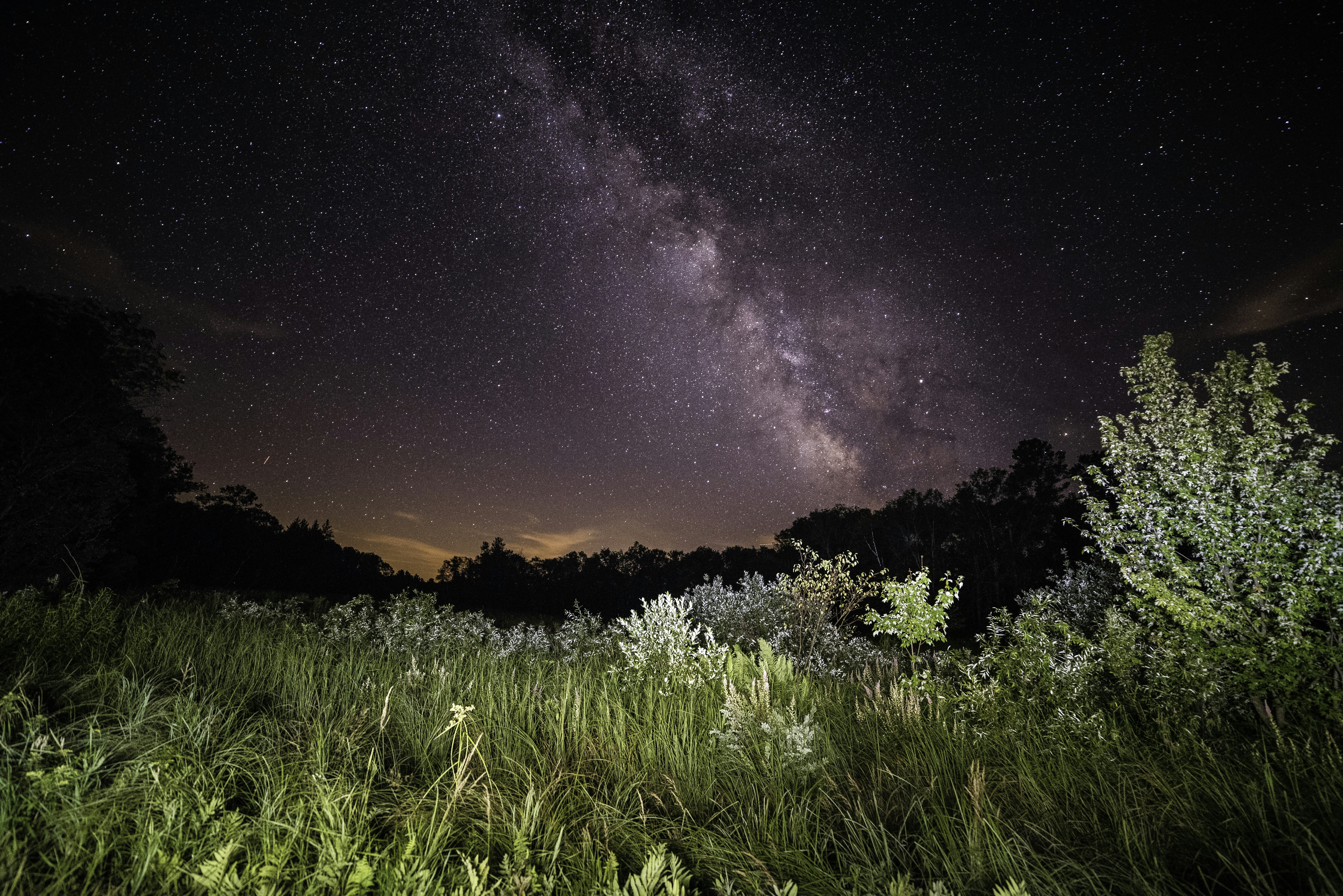 time lapse photography of sky over grass