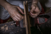 person operating power tool