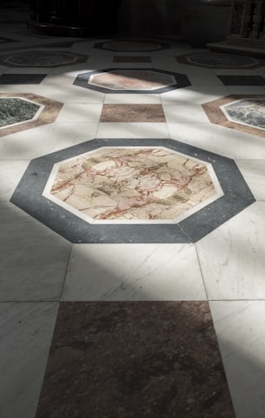 Marble floor tiles arranged in a classic pattern inside a Barcelona residence.
