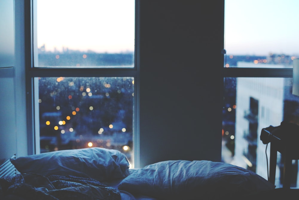 two white pillows beside window