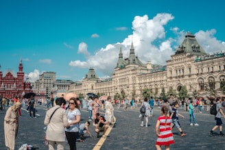 A group of travelers happily exploring a vibrant city square.
