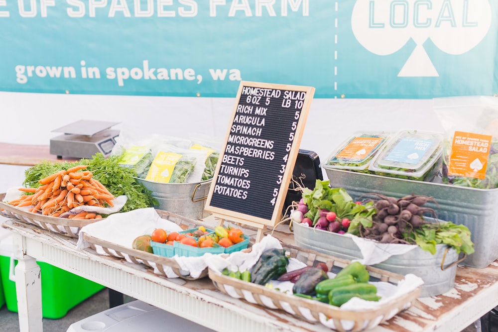 variety of vegetables with price sign on table