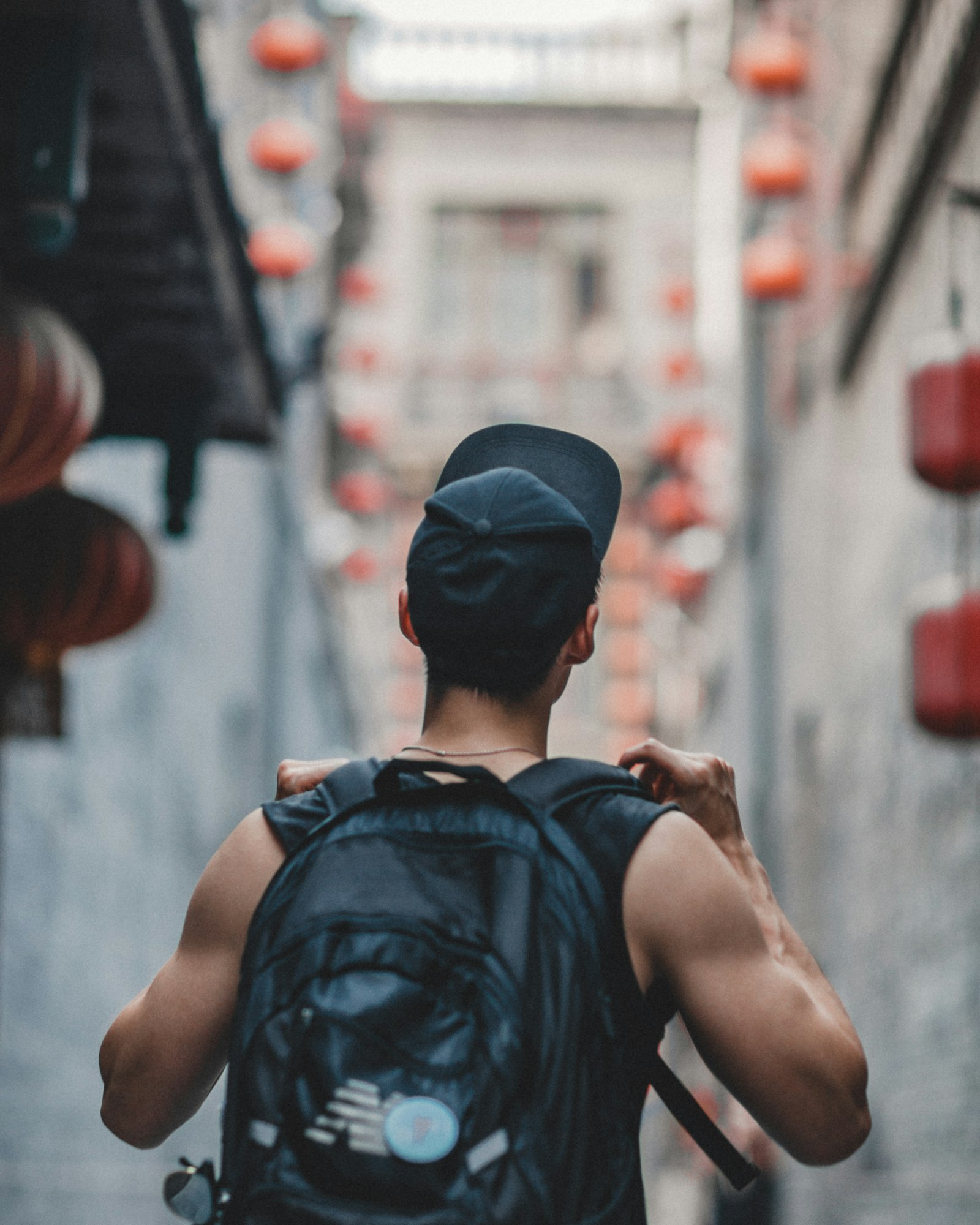 Canon EOS 5D Mark II + Canon EF 85mm F1.2L II USM sample photo. Man holding black backpack photography