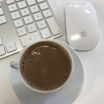 A clean, straightforward online form on a laptop screen with a cup of coffee nearby.