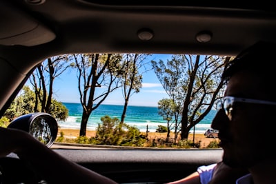 man driving car