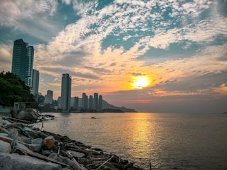 A serene beachfront office with a view of Honolulu skyline at sunset.