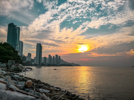 A serene beachfront office with a view of Honolulu skyline at sunset.