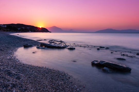 body of water during sunset in Icaria Greece