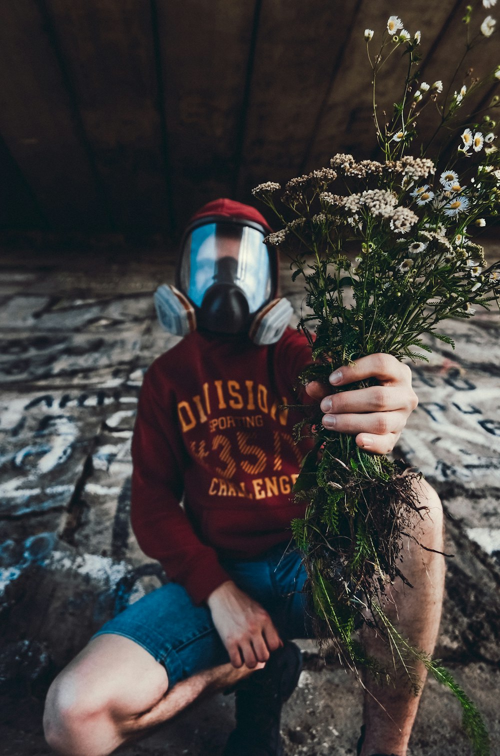 man holding white flowers