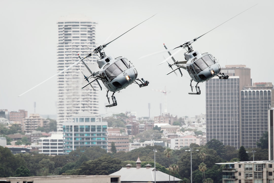 two flying helicopters