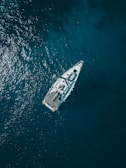 aerial view of white boat sailing