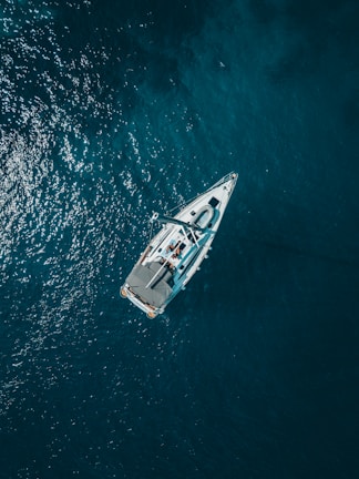 aerial view of white boat sailing