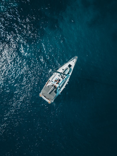 aerial view of white boat sailing