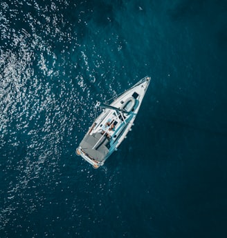 aerial view of white boat sailing