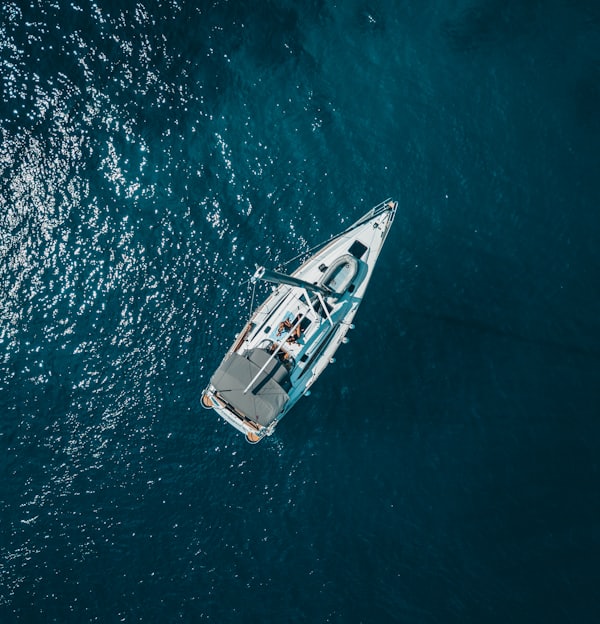 aerial view of white boat sailing