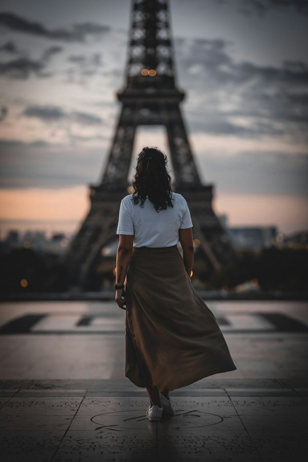 woman standing in front of Eiffel tower