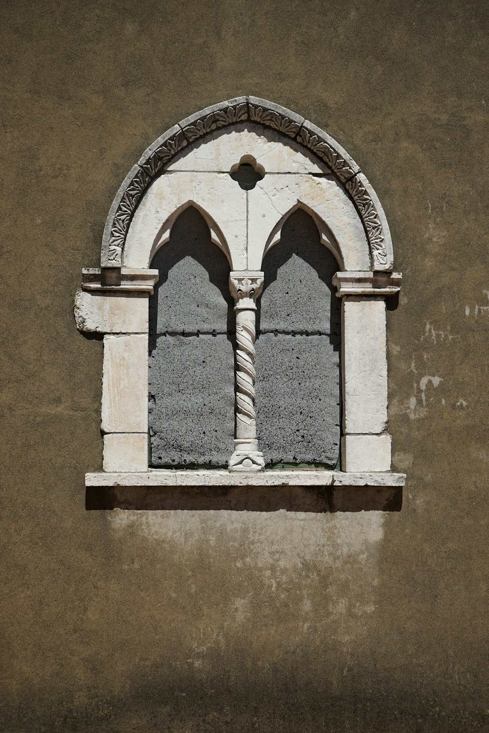 white concrete arch window