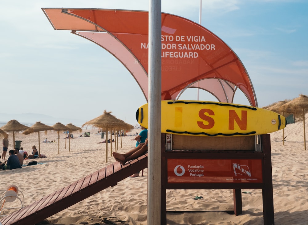 Lifeguard booth on beach under blue sky