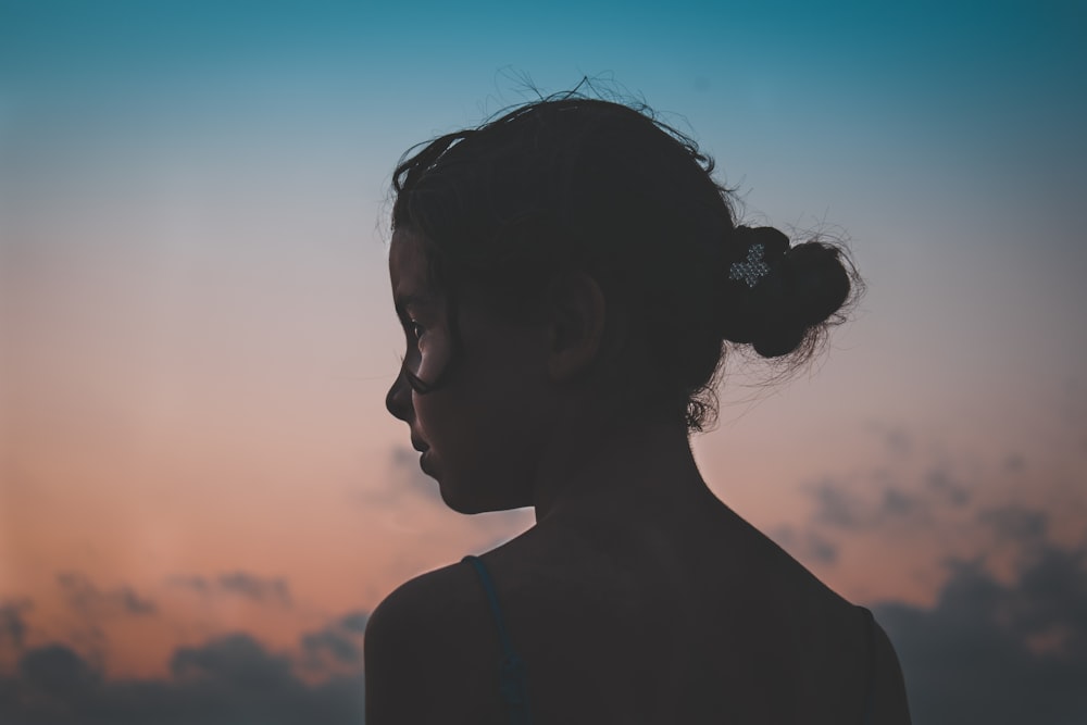 woman standing under blue sky during daytime