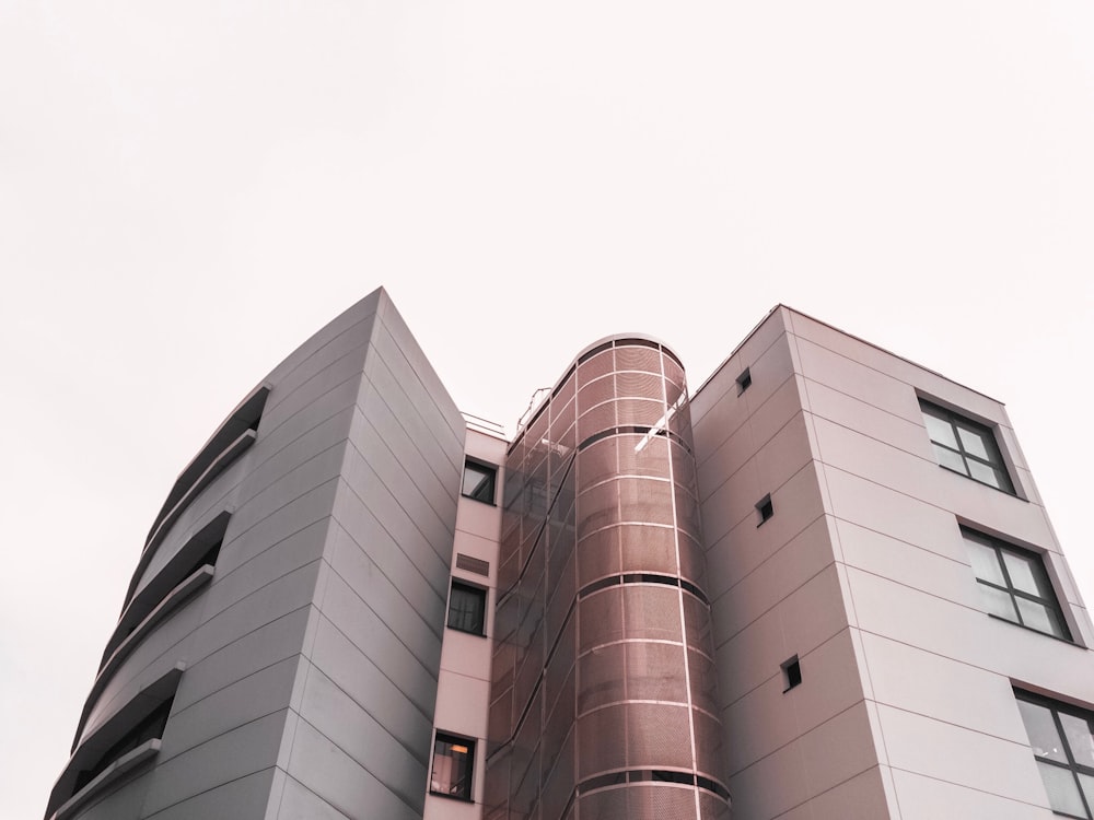 low angle photography of brown and white concrete building