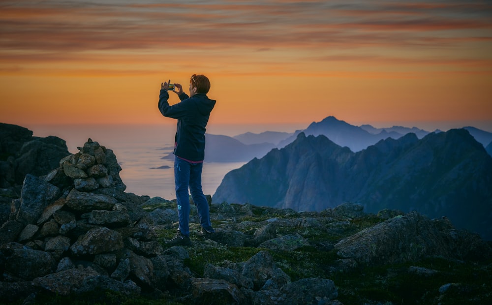 man standing on stones during daytime