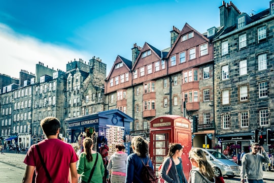 people walking beside telephone booth during daytime in Princes Street Gardens United Kingdom