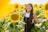 woman surrounded with sunflowers at daytime