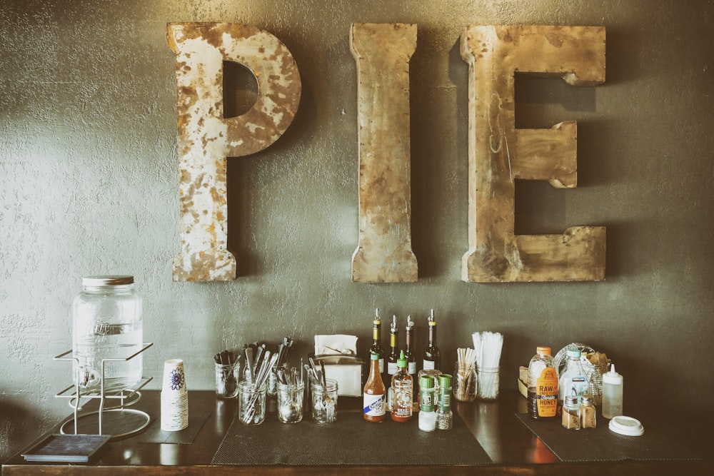 assorted bottles on top of brown wooden table