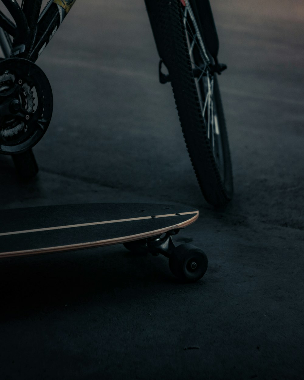 cruiser board beside bicycle