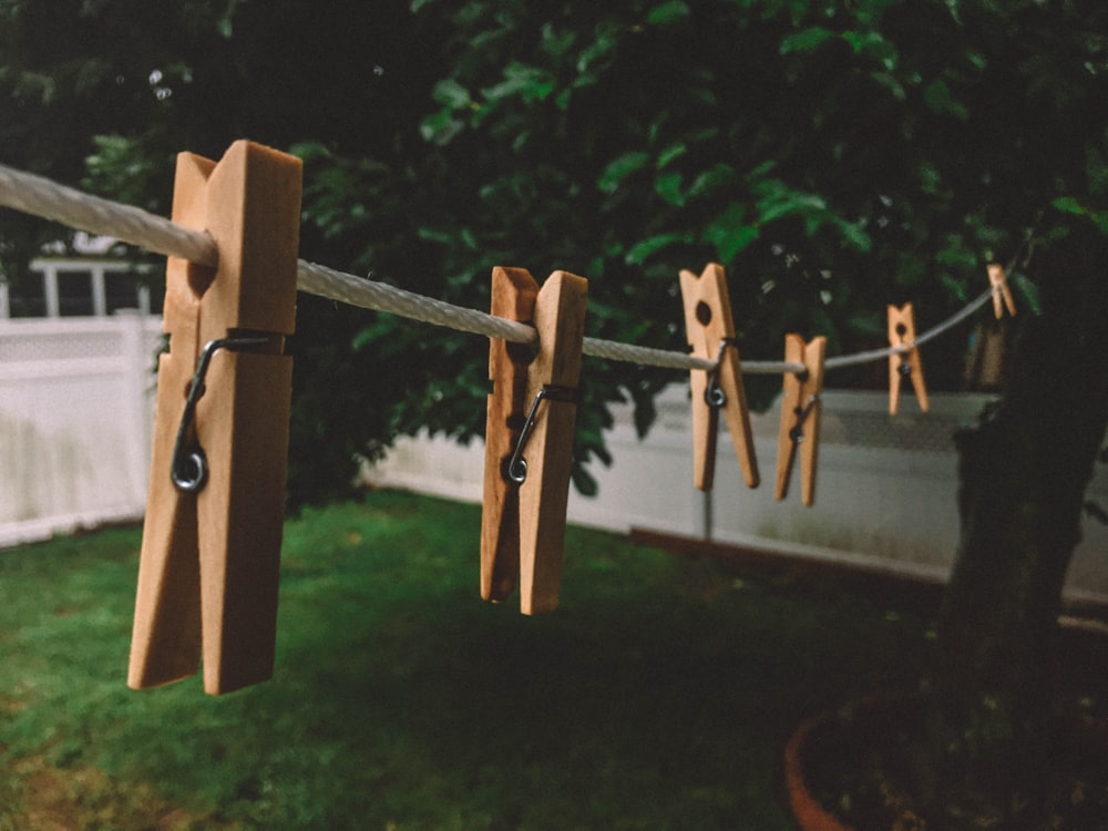 brown clothespin in white rope