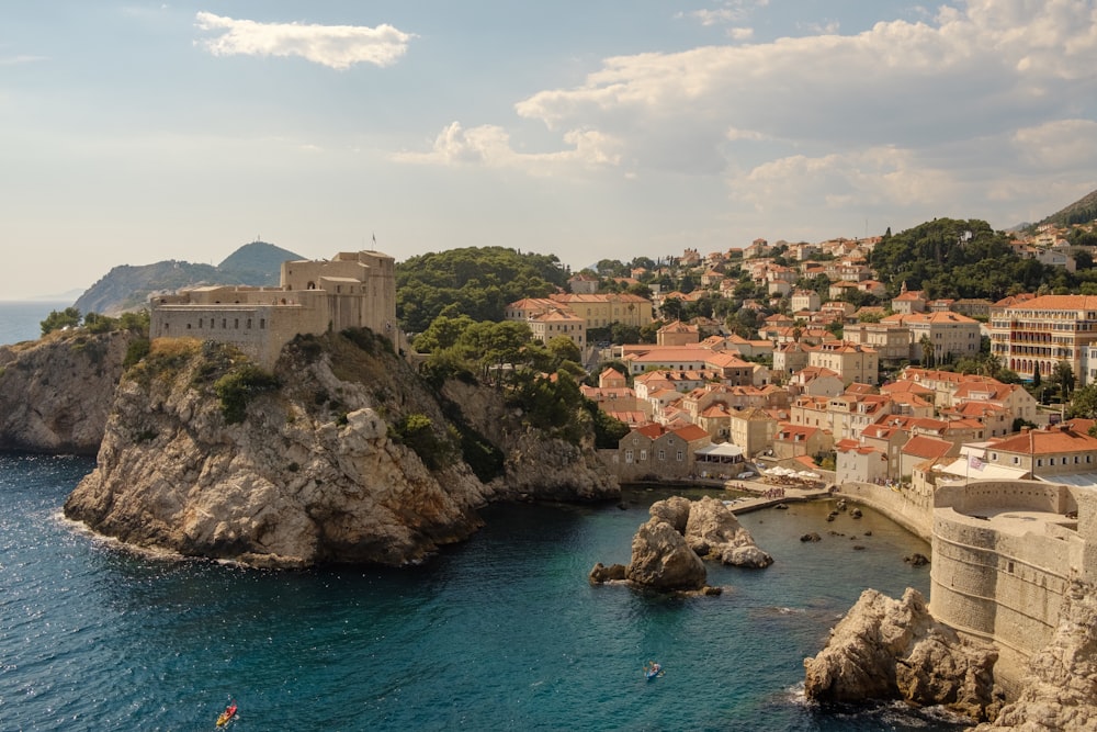 village and cliffs in aerial view photography