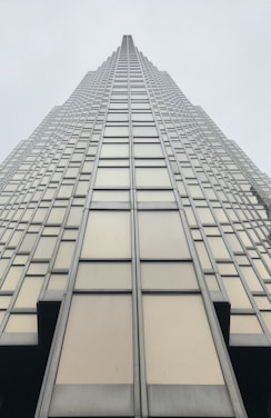 low angle photography of grey glass building