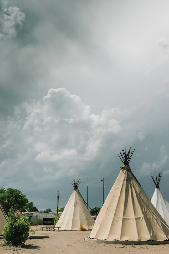white teepee tents under cloudy sky in Marfa United States