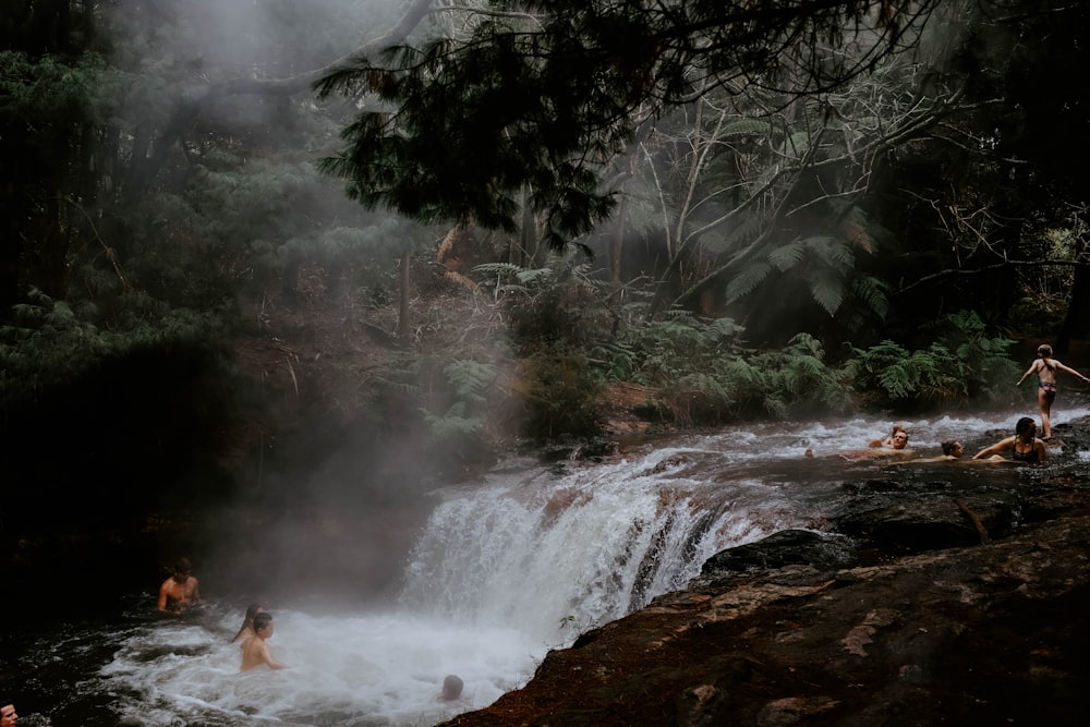 group of people on waterfalls