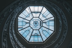 low angle photography of glass ceiling