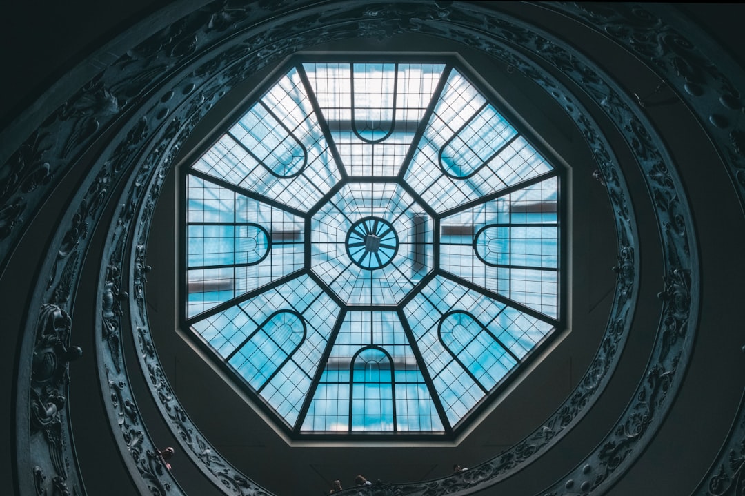 low angle photography of glass ceiling