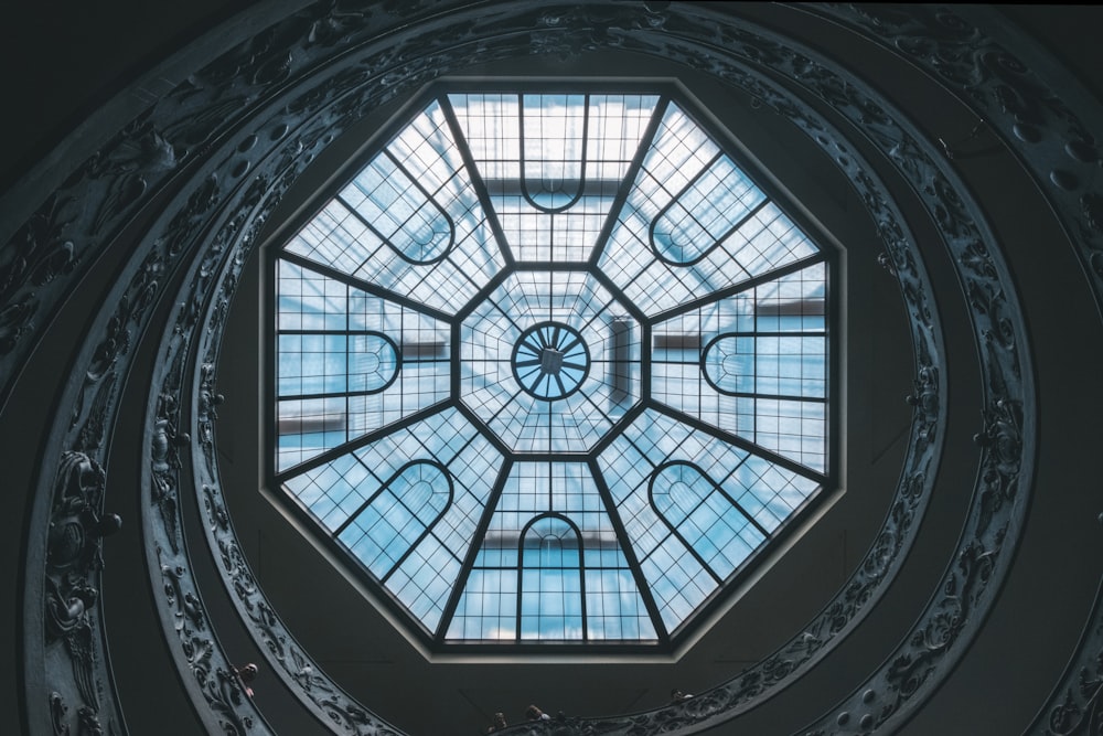 low angle photography of glass ceiling