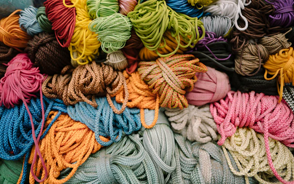 A neat arrangement of colorful cords representing different types of love knots