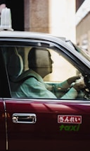Happy customers stepping into a clean, comfortable taxi in Garmisch.